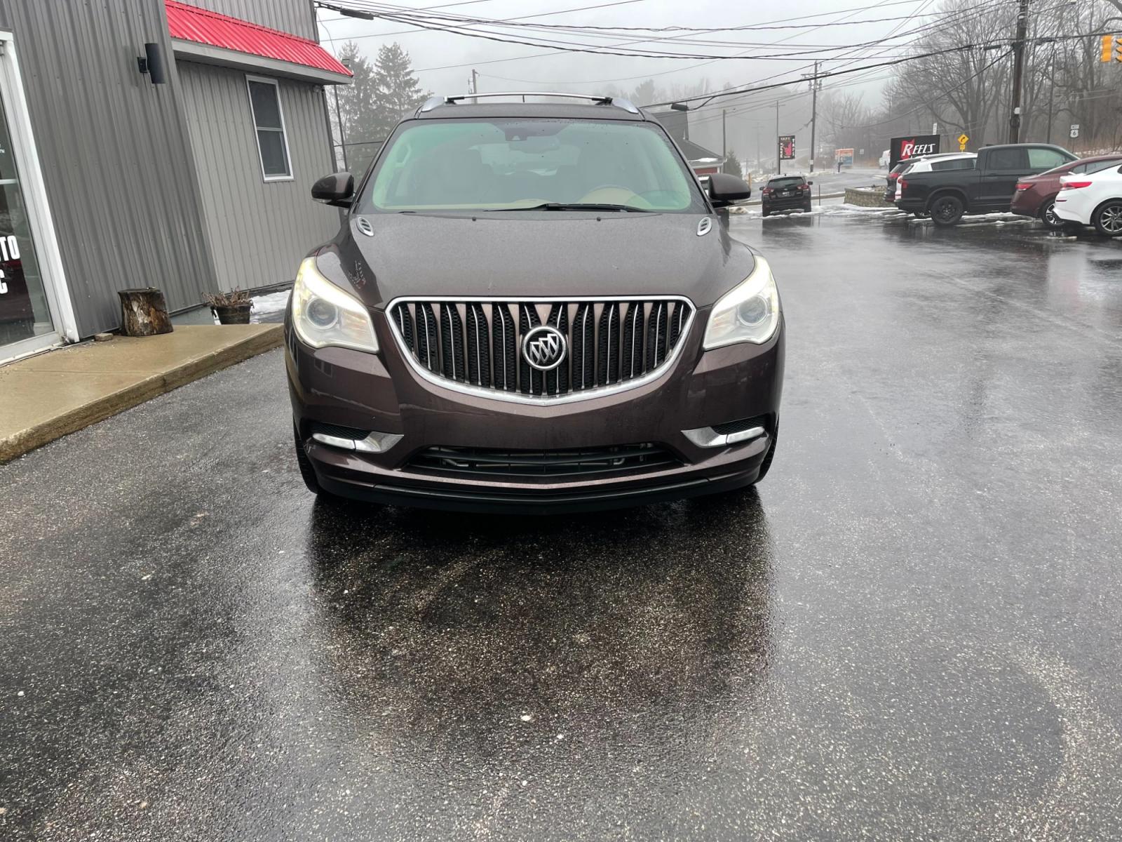 2016 Brown /Brown Buick Enclave Premium AWD (5GAKVCKD4GJ) with an 3.6L V6 DOHC 24V engine, 6A transmission, located at 547 E. Main St., Orwell, OH, 44076, (440) 437-5893, 41.535435, -80.847855 - This 2016 Buick Enclave Premium AWD boasts a luxurious range of features including single-owner status, climate-controlled leather seats, adaptive HID headlights for improved visibility, and safety features like blind spot monitoring and rear cross-traffic alert. Its towing capability is notable at - Photo #1